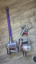 Two hand held Dyson vacuum